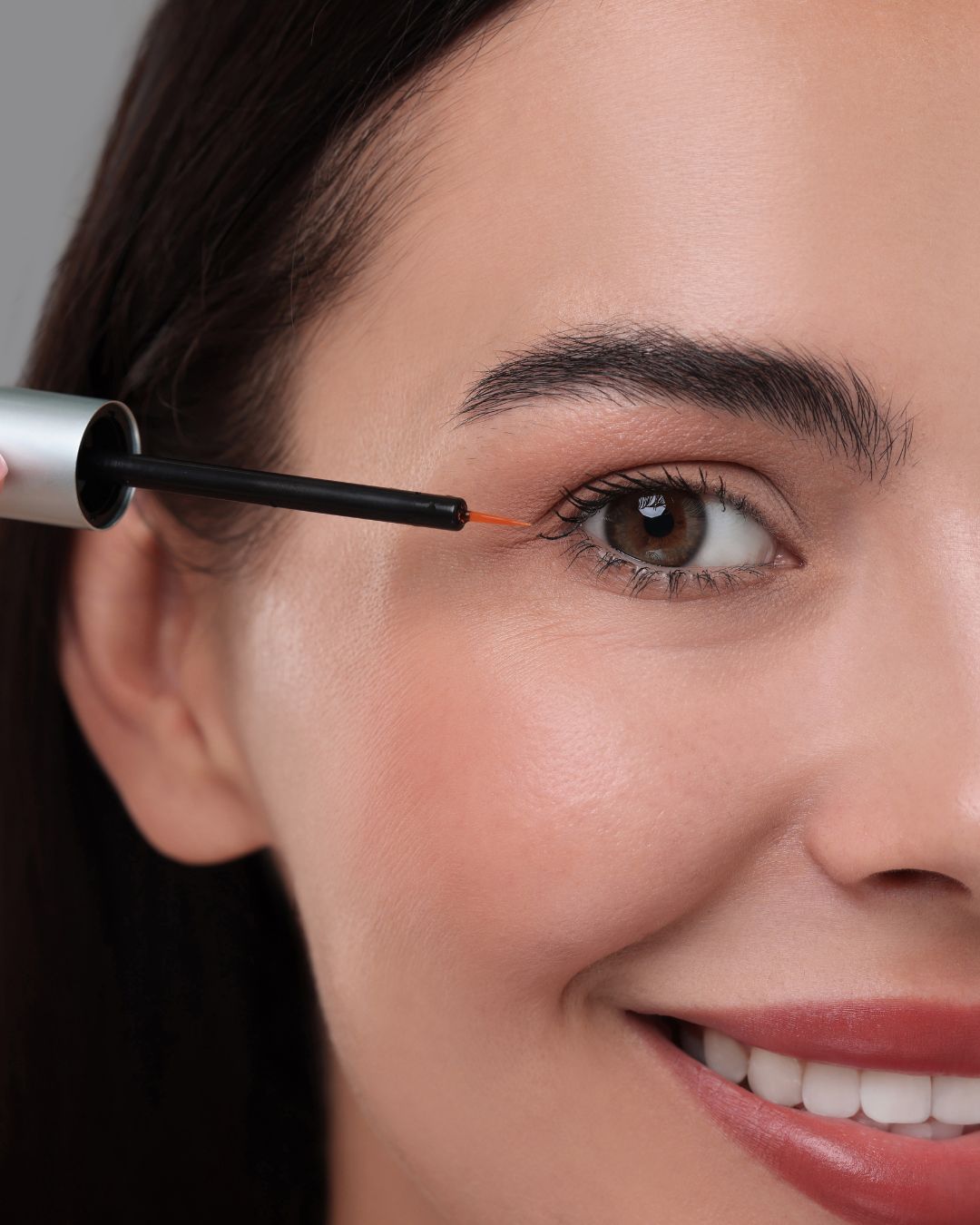 Take the tip of the wand and draw it slowly over the root of your eyelashes. Try to do this in one continuous stroke for the most effective application.